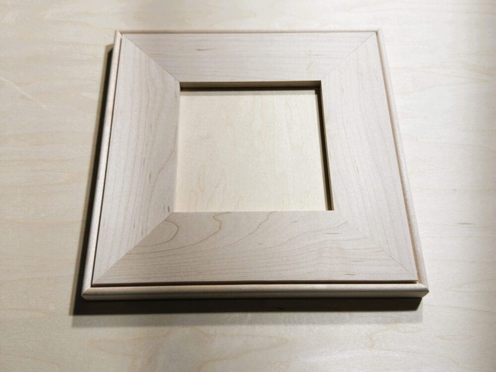 Mitered flat-panel door sample with outside-bead profile