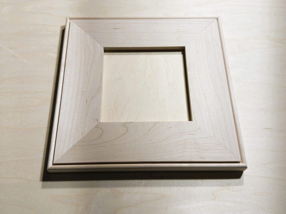 Mitered flat-panel door sample with outside-bead profile