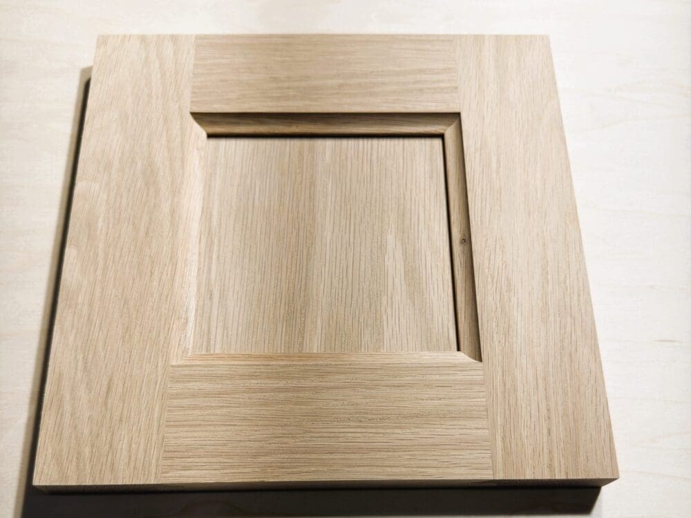 Flat-panel door sample with cove inside-edge profile in White Oak